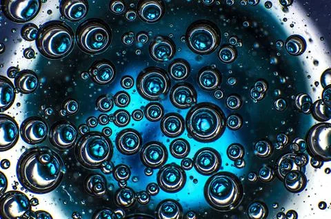 Macro shot of the soap bubbles on an abstract blue background Stock Illustration