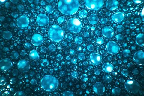 Macro shot of the soap bubbles on a blue background Stock Illustration