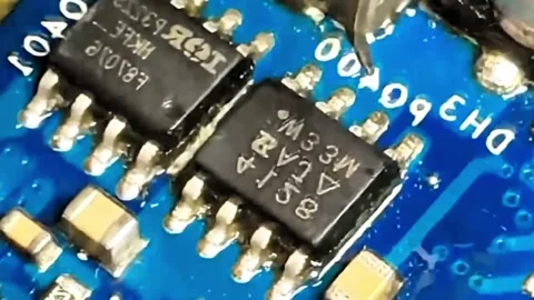 Macro Shot of Soldering and Removing Micro IC Chip on Circuit Board Stock Footage 333553003