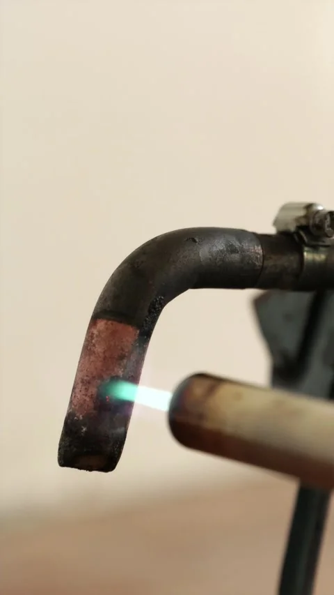 Macro shot of soldering iron tip heating up vertical Stock Footage 339298265