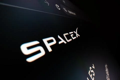 Macro shot of SpaceX logo on its website Stock Photos