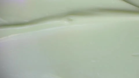 Macro Shot of Spatula Swiping Smooth Light Green Facial Cream Texture Vídeo Stock 340851271