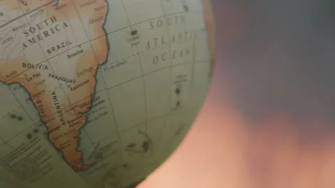 Macro Shot of a Spinning World Globe in Front of an Outdoor Fire 動画素材 208803305