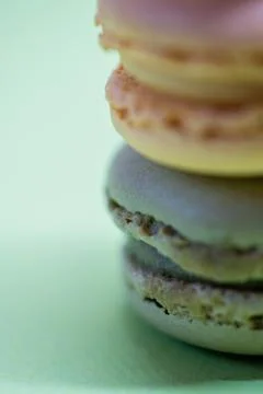 Macro shot of stack of macarons over green mint background Fotos Stock