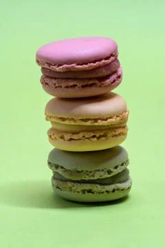 Macro shot of stack of macarons over green mint background 写真素材