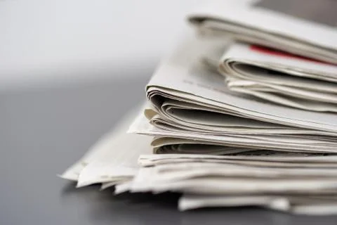 Macro shot of a stack of newspapers. The newspapers are folded Stock Photos