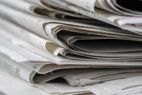 Macro shot of a stack of newspapers. The newspapers are folded Stock Photos