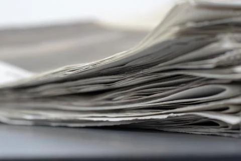 Macro shot of a stack of newspapers. The newspapers are folded Stock Photos