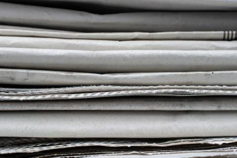 Macro shot of a stack of newspapers. The newspapers are folded Stock Photos