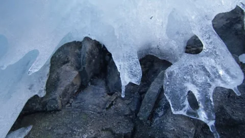 Macro shot of a stalactic frozen on rock, in the Alps, Switzerland Stock Footage 240143085