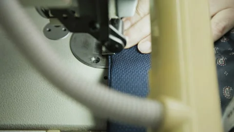 Macro shot of stitching male jacket with sewing machine. 4K Video stock 89665847
