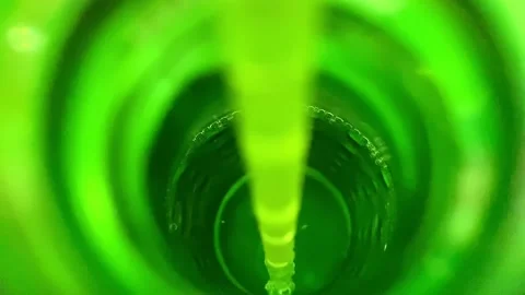 Macro Shot Of Straw In Green Bottle With Bubbles Fizzing. Birds Eye View Stock Footage 228704958