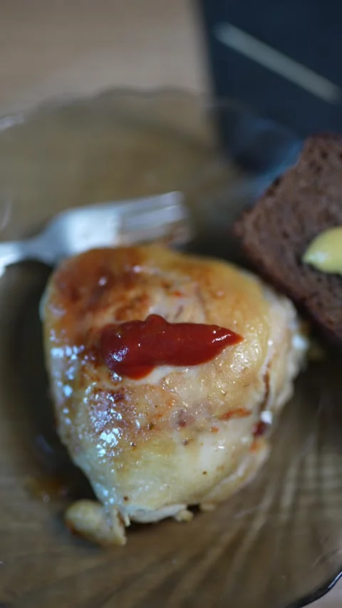 Macro shot of succulent roasted chicken with ketchup Stock Footage 331198722