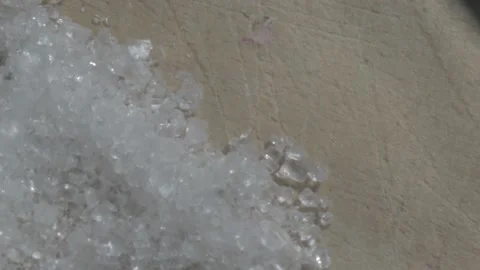 Macro shot of sugar cane crystals on a wood board while a knife is used to coll2 Stock Footage 139426231