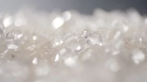 Macro shot of sugar falling down in slow motion Stock Footage 194482912