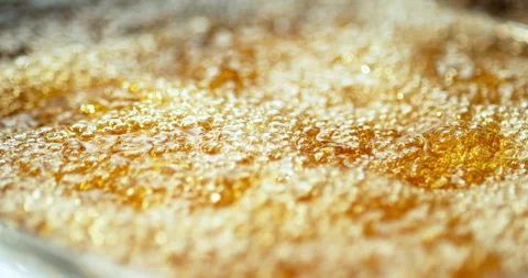 Macro shot of surface hot oil bubbles in super slow motion Stock Footage 310528729