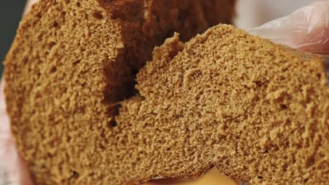 Macro shot: tearing bread texture with hands Stock Footage 171760550