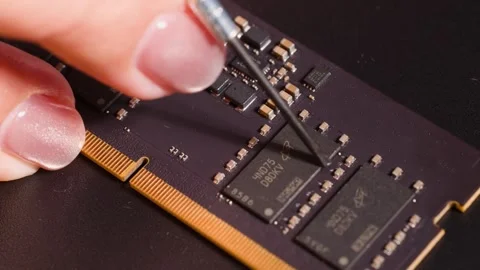 Macro Shot of Technician Repairing Computer RAM Module with Precision Tool Stock Footage 326707881