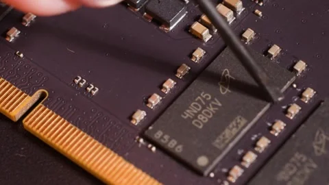 Macro Shot of Technician Repairing Microchip on Computer Circuit Board Stock Footage 327446397