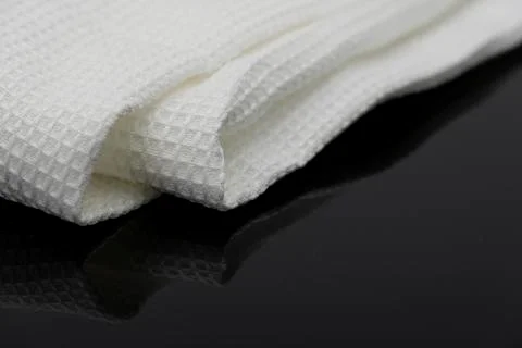Macro shot texture of folded white towel kitchen fabric with copy space text Stockfoto's