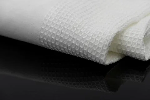 Macro shot texture of folded white towel kitchen fabric with copy space text 스톡 사진