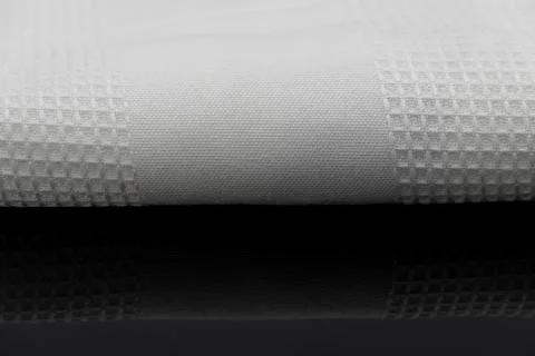 Macro shot texture of folded white towel kitchen fabric with copy space text 스톡 사진