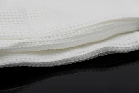 Macro shot texture of folded white towel kitchen fabric with copy space text Stock-Fotos