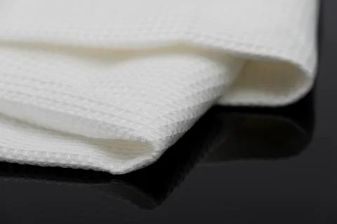 Macro shot texture of folded white towel kitchen fabric with copy space text Stock Photos