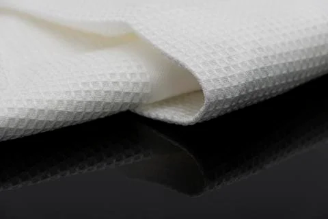 Macro shot texture of folded white towel kitchen fabric with copy space text Stock-Fotos