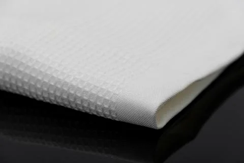 Macro shot texture of folded white towel kitchen fabric with copy space text 스톡 사진