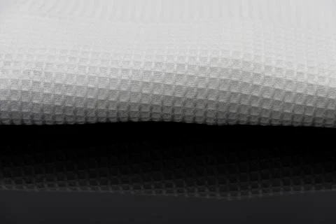 Macro shot texture of folded white towel kitchen fabric with copy space text Stock Photos