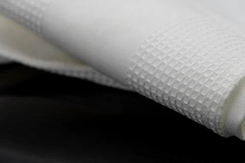 Macro shot texture of folded white towel kitchen fabric with copy space text Foto stock