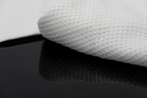 Macro shot texture of folded white towel kitchen fabric with copy space text 스톡 사진