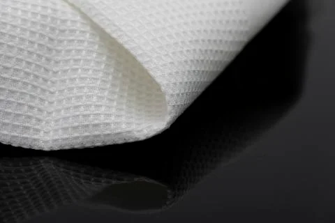 Macro shot texture of folded white towel kitchen fabric with copy space text Stock Photos