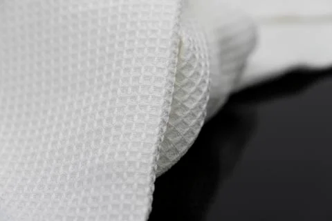 Macro shot texture of folded white towel kitchen fabric with copy space text Stock Photos