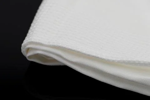 Macro shot texture of folded white towel kitchen fabric with copy space text Stock-Fotos