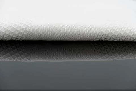 Macro shot texture of folded white towel kitchen fabric with copy space text 스톡 사진