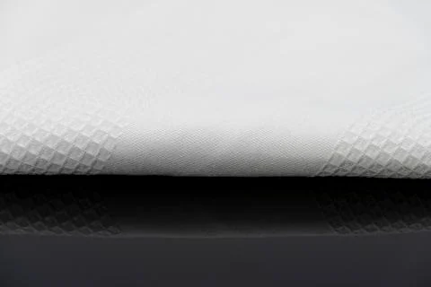 Macro shot texture of folded white towel kitchen fabric with copy space text 스톡 사진