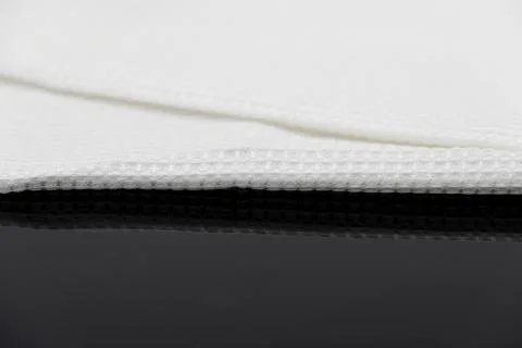 Macro shot texture of folded white towel kitchen fabric with copy space text Foto stock