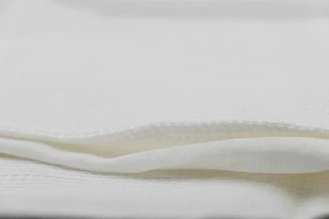 Macro shot texture of folded white towel kitchen fabric for background design 스톡 사진