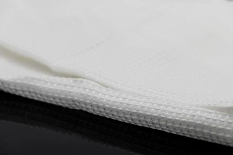 Macro shot texture of folded white towel kitchen fabric with copy space text Stock-Fotos