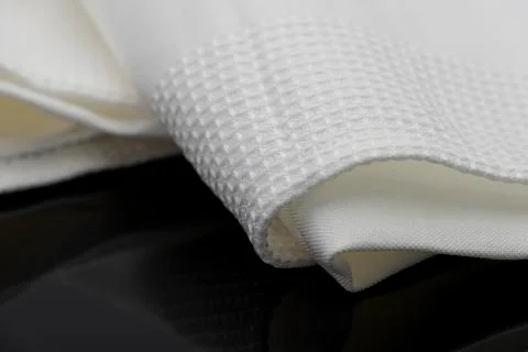 Macro shot texture pattern of folded white towel kitchen fabric 스톡 사진