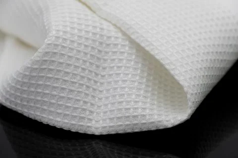 Macro shot texture pattern of folded white towel kitchen fabric Stock Photos