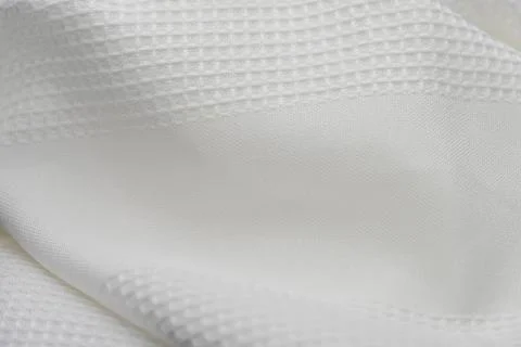 Macro shot texture pattern of folded white towel kitchen fabric Stock Photos