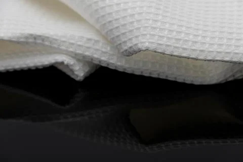 Macro shot texture pattern of folded white towel kitchen fabric Stock Photos