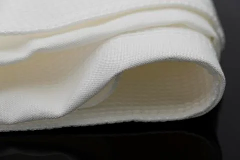 Macro shot texture pattern of folded white towel kitchen fabric Stock Photos