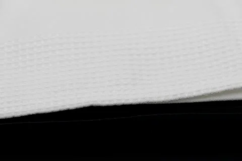 Macro shot texture pattern of folded white towel kitchen fabric Stock-Fotos