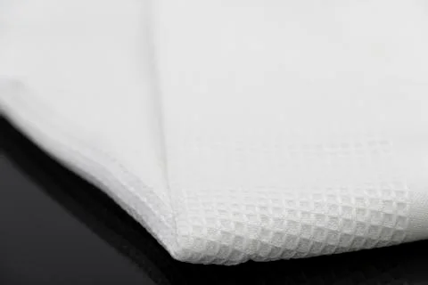 Macro shot texture pattern of folded white towel kitchen fabric Foto stock