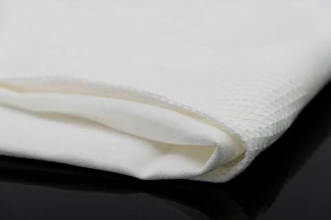 Macro shot texture pattern of folded white towel kitchen fabric Stock Photos