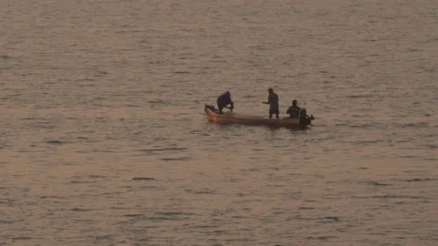 Macro shot of three men rowing boat in lake water Stock Footage 150718540